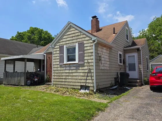 Corner of a house showing new gutter and downspout