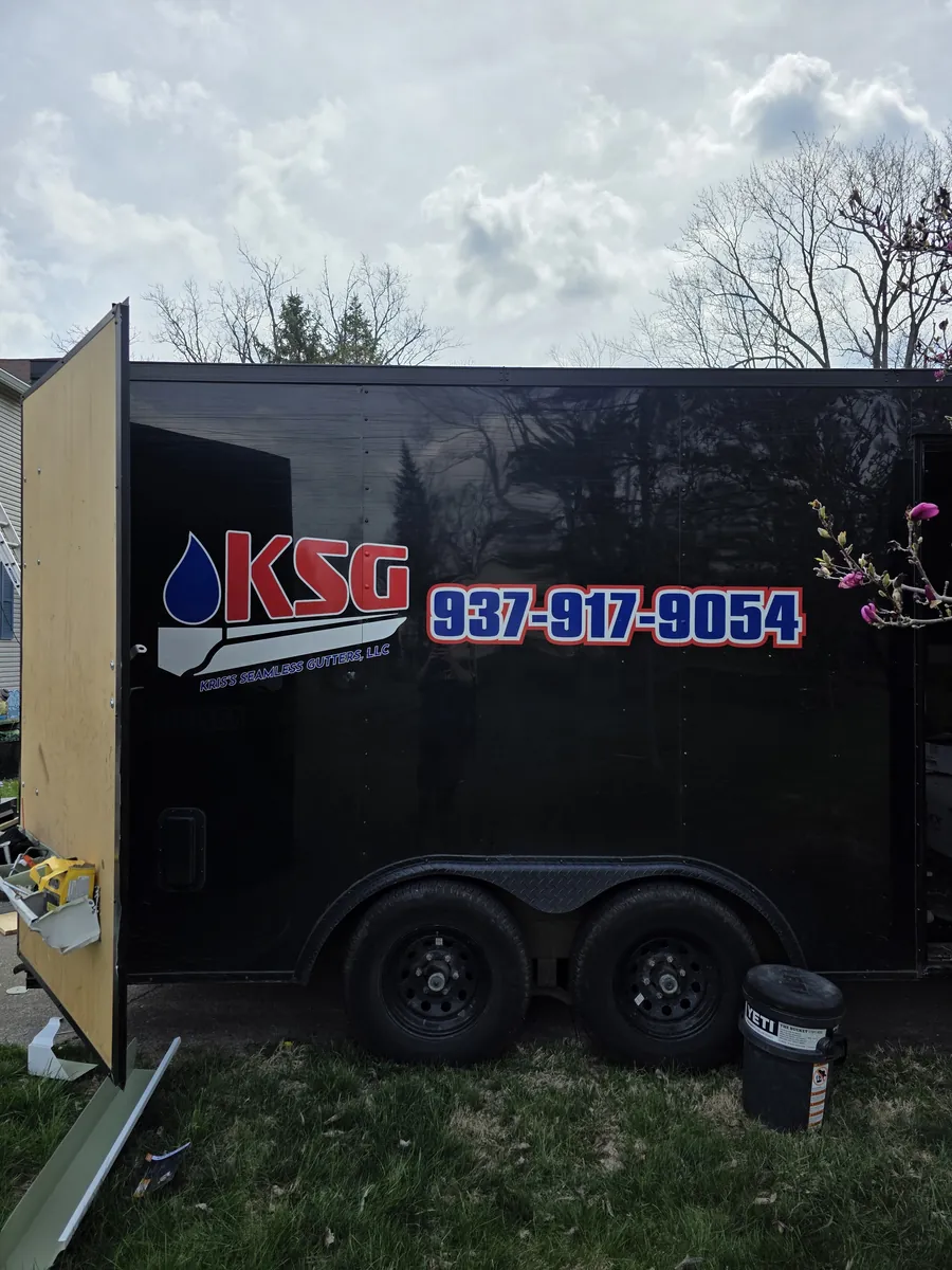 The KSG work trailer on site, with the company name and phone number on the side
